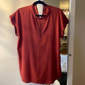 Express rust colored v cutout blouse size L